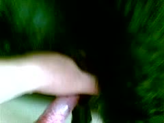 A lustful woman removing a dog cock